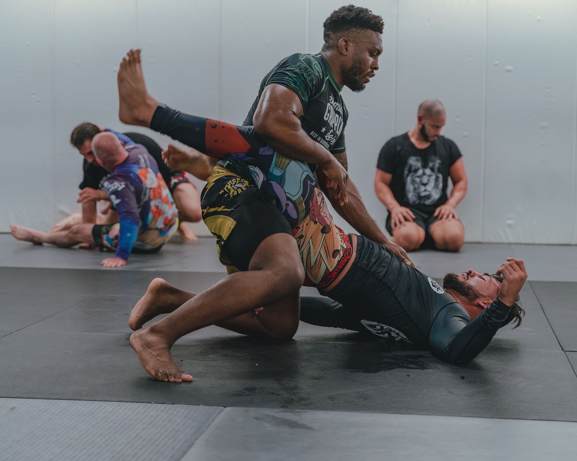 Training partners grappling together on the gym mats